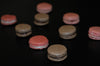 Three rows of French macaroons filled with ganach or jam