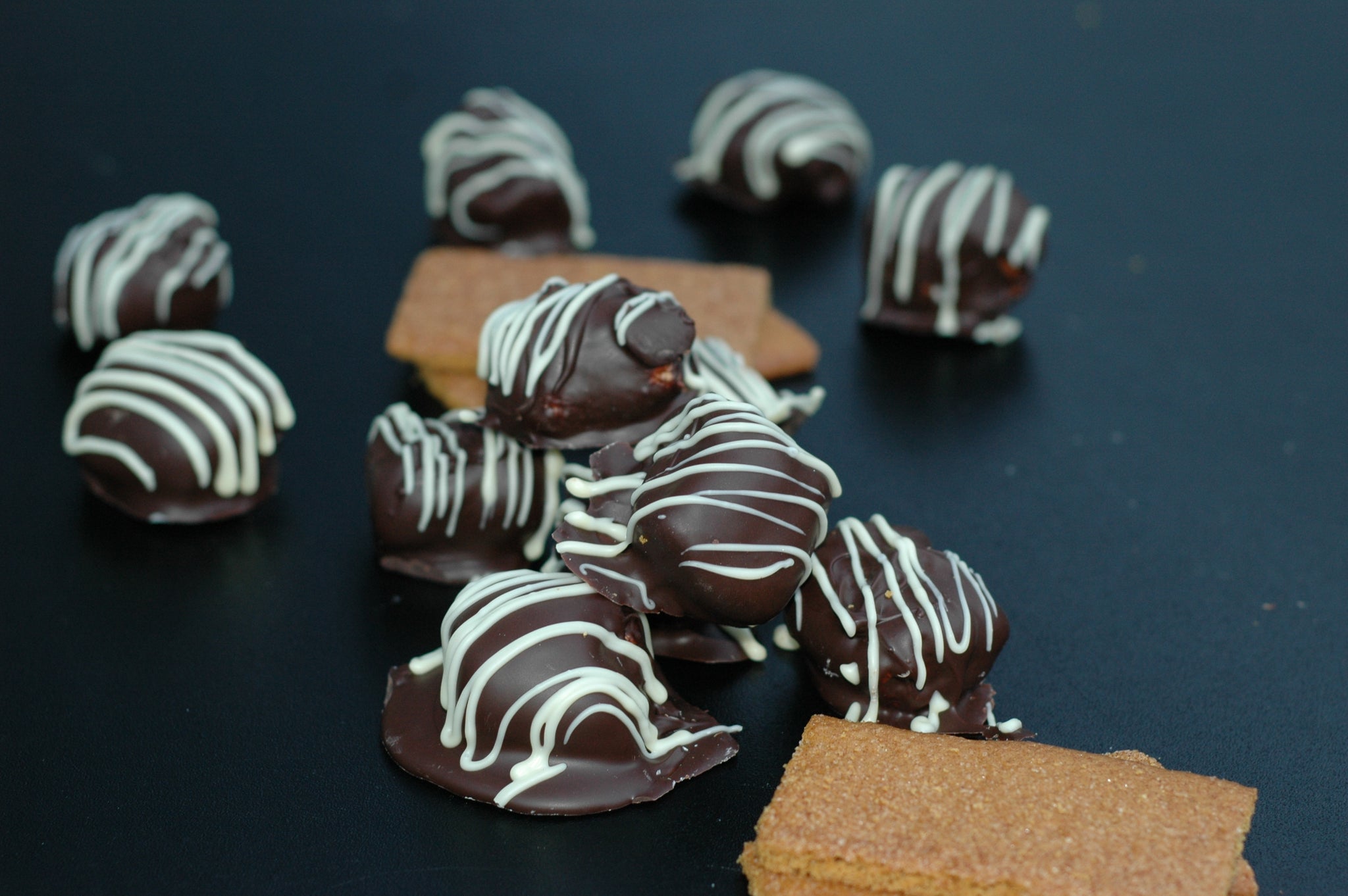 Chocolate dipped fresh marshmallows with white chocolate drizzle