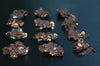 Almonds, pecans and walnuts dipped in chocolate to make chocolate clusters