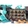 A box of hand-painted chocolates filled with orange and cardamon infused ganache